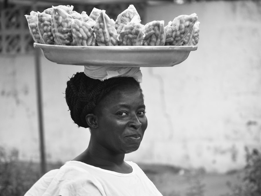 Ghanaian vendor selling food at a local market in Accra