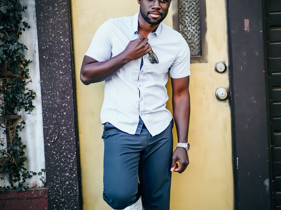 African business owner seated outside a café-style shopfront