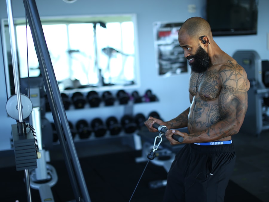 Black man training with weights in a gym